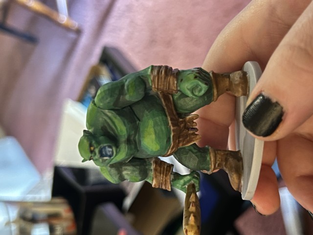 Green ogre miniture with a club.
